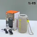 Close-up view of portable wireless Bluetooth speaker with fabric mesh and control buttons. - Light Gray