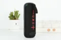 Enceinte Bluetooth portable avec tissu noir et design cylindrique pour audio sans fil. - Noir