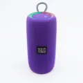 Tragbarer violetter kabelloser Bluetooth-Lautsprecher mit Stoffnetz und oberer Steuerung. - Lila