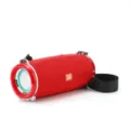 Tragbarer Bluetooth Lautsprecher mit rotem Stoffnetz, Tragegurt und klarem Sound. - Rot