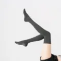 Dark grey over-the-knee yoga pilates grip socks with non-slip soles for cozy workouts. - One Size / Dark Gray