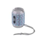 Portable wireless Bluetooth speaker featuring blue geometric fabric mesh and a convenient hanging strap. - Unakite