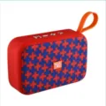 Portable bluetooth speaker detail view showing red body texture and control buttons clearly. - Marbled Red