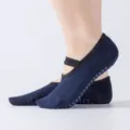 Chaussettes de yoga antidérapantes à brides croisées bleu foncé avec des pois colorés. - Taille unique / Bleu Marine