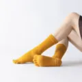 Comfortable yellow five-toe yoga socks with anti-slip grip soles for pilates and fitness. - One Size / Helios Yellow