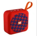 Altoparlante Bluetooth portatile wireless rosso con cinturino arancione e griglia in tessuto. - Rosso Floreale