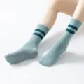 Long anti-slip yoga socks with double stripes worn on model feet for workout and pilates view - One Size / Double Bar Style - Blue