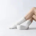 Women's white mid-calf yoga pilates grip socks with non-slip dots and thick fleece. - One Size / White