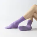 Purple mid-tube yoga socks with anti-slip grip dots, perfect for pilates and fitness workouts. - One Size / Light Purple