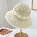 Beige hollow woven straw hat, stylish wide brim bucket hat variant for summer beach sun protection. - One Size / Beige