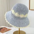 Blue and white crochet straw bucket hat with delicate hollow-out pattern for summer sun protection. - One Size / Light Blue