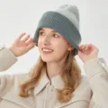 Close-up detail shot of the two-tone knitted winter beanie hat showing fine texture. - M (54-58cm) / Teal