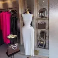 Elegant sleeveless long dress for women featuring waist pleats and stylish metal buckle. - S / White
