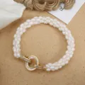 Elegantes dreireihiges Süßwasserperlen Armband mit schönem Goldschmuckverschluss. - Armband / 17cm / Gold