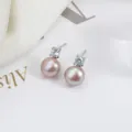 Klassische rosa Süßwasserperlen Ohrstecker mit 925er Silberstift und funkelnden Zirkonsteinen. - Silberne Basis / Natürliches Rosa Lila