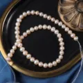 Filo di perle d'acqua dolce naturali, perle bianche lisce a forma di uovo da 7mm per creazione. - Circa 40-41cm Circa 56 Pezzi / Filo di Perle d'Acqua Dolce Naturali (8835) / 56 Pezzi/Confezione / Arancio Rosa Naturale