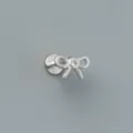 Close-up view of a minimalist S925 sterling silver bow stud earring with CZ stone. - Mini Bow Style (EH1772) / 1PC / White Gold