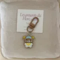 Cute cartoon pajama brown bear keychain pendant, close-up view of the adorable bag charm accessory. - Coffee Bear
