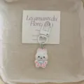 Cute cartoon rabbit keychain pendant with white clasp and printed card detail view. - White Rabbit