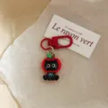 Cute black cat apple keychain detail shot, perfect bag charm and lovely student gift accessory. - Black Cat