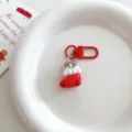 Close-up view of a cute cartoon cat in a Christmas stocking keychain pendant, elegant display. - Socks