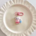 Cute surfing bear keychain charm detail view, pink resin bag pendant and schoolbag accessory. - Charm / Pink Surfing Bear