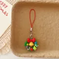 Detailaufnahme des Weihnachts-Handyanhängers mit Kranz, Glocke und roter Schleife. - Weihnachtskranz / Weihnachtskranz Handy-Lanyard