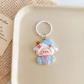 Cute cartoon sheep keychain, adorable bag charm pendant for keys and backpacks. Detail view. - Large Sheep / Blue Clothes