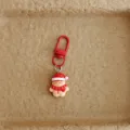 Detailed close-up shot of the cute Christmas gingerbread man keychain metal clasp. - Gingerbread Man