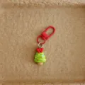 Cute Christmas tree bag charm close-up detail, festive cartoon hanging ornament for holiday gifts. - Christmas Tree
