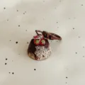 Detailed shot of a cute simulation strawberry chocolate cake keychain, perfect bag pendant and gift. - Fruit Cake - Coffee
