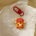Cute New Year red capybara keychain detailed shot, perfect bag charm and festive gift. - New Year Capybara - Red Hat