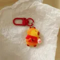 Cute red capybara keychain detail, festive pendant with scarf for backpack bag charm. - New Year Capybara - Prosperity