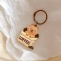 Cute capybara coffee cup keychain charm, detailed resin animal backpack pendant accessory. - Capybara Coffee Bean Style