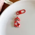 Close up of a cute Chinese opera character keychain pendant, red resin charm detail. - 1 Piece/Pack / Red