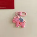 Pink cartoon horse keychain with money bag charm, stylish bag pendant and cute gift accessory. - Pink Pony