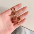Cute cartoon brown cat keychain detail view, lovely bag charm and backpack accessory. - Coffee