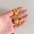 Cute cartoon cat keychain pendant with yellow metal clasp, creative bag charm accessory gift. - Yellow