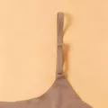 Close-up detail of the adjustable bra strap and metal buckle, showing smooth fabric. - S / Tops / Dark Brown