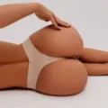 Women's sexy seamless solid color thong underwear, high elasticity ice silk low rise brief. - S / Nude