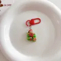 Cute Christmas gingerbread man keychain detail shot, red gift bag bag charm holiday ornament. - Cute Christmas Pendant - Gift Box