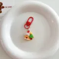 Cute Christmas keychain with resin gingerbread house and tree pendant for holiday gifts. - Cute Christmas Pendant - House