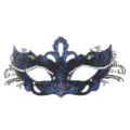 Close-up detail of ornate metal filigree masquerade mask with sparkling rhinestones and blue glitter. - Blue Gold