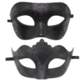 Close-up details of black masquerade masks with glitter patterns, ideal for party decor. - Black
