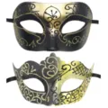Close-up detail of black and gold masquerade masks with glitter patterns for party costumes. - Gold
