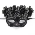 Black sequin masquerade mask detail, rhinestone floral decor closeup for party carnival. - Black