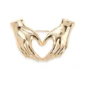 Gold hand heart brooch detail, stylish minimalist fashion accessory for apparel decoration. - Gold