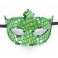 Detailaufnahme der glitzernden grünen Pailletten Maske Textur für Karneval und Party Kostüme. - Laser Grün