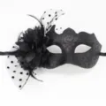 Detailed shot of black masquerade mask with mesh flower and glitter scrolls - Polka Dot Mesh + Flower Small Horn Black