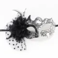 Detailed view of an elegant black and silver masquerade mask with mesh and floral accents. - Polka Dot Mesh + Flower Small Horn Silver